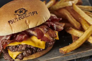 A mouthwatering double cheeseburger with crispy bacon and a side of golden fries. This classic combo begs for the perfect sauce pairing.