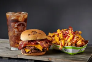 A BurgerFi meal with burgers, fries, and Coke.
